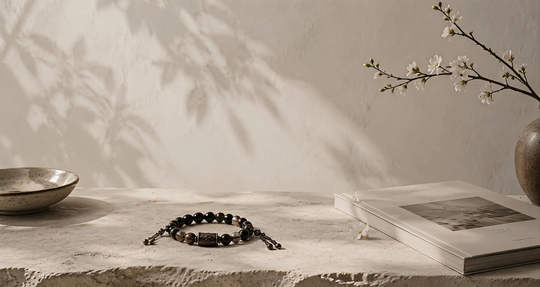 A Strandzen bracelet resting on a quiet stone workbench before final assembly