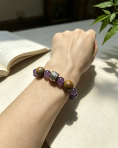 Maze Confidence bracelet worn on wrist with amethyst and wood beads thumbnail