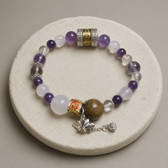 Lotus Reverie finished crystal bracelet in purple, milky white, clear, and smoky violet tones thumbnail