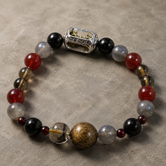 Iron Vow finished crystal bracelet in black, deep red, smoky gray, clear, and warm wood tones thumbnail