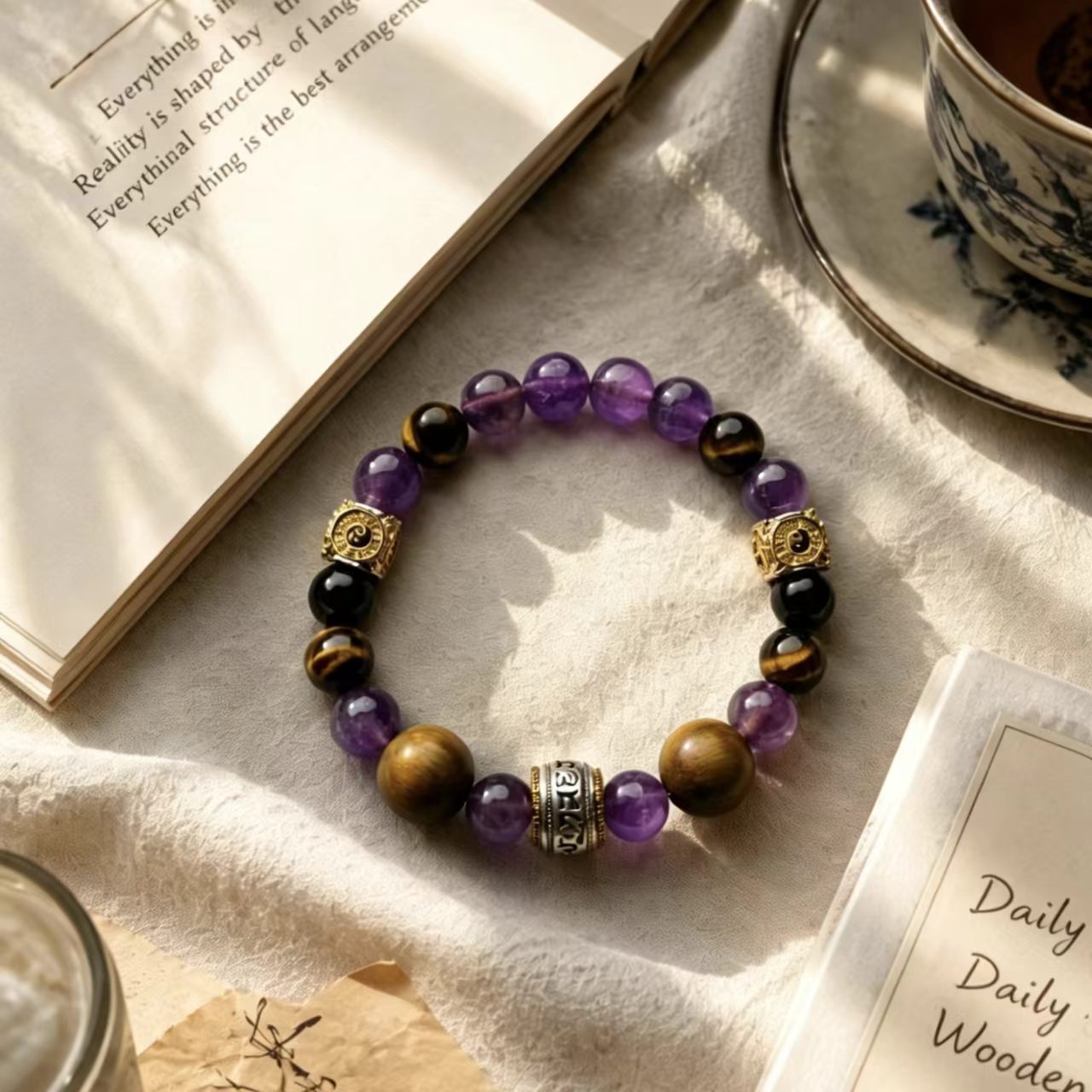 Maze Confidence crystal bracelet styled with book and tea