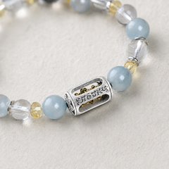 Still Ground Plan B silver-tone rectangular focal bead and pale blue crystal bead detail thumbnail