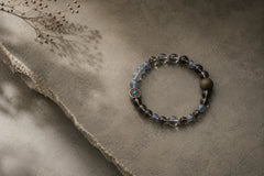 Double Guard Plan B bracelet photographed on dark textured paper with soft directional light thumbnail