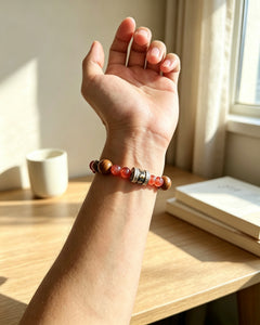 Lotus Start New Start bracelet worn on wrist in warm window light thumbnail