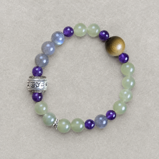 Lotus Start Plan B bracelet with pale green, purple, blue-gray, warm brown, and silver-tone details on light stone