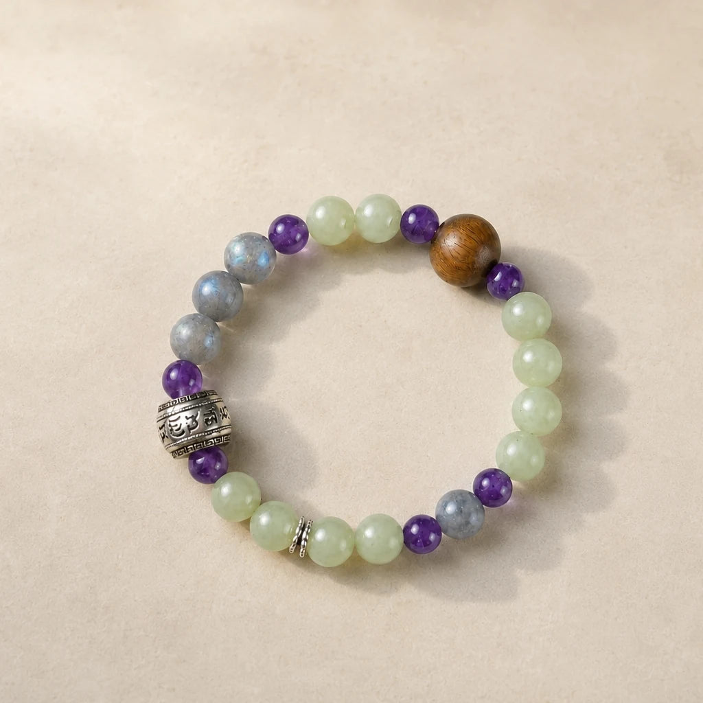 Lotus Start Plan B bracelet with pale green, purple, blue-gray, and warm brown beads