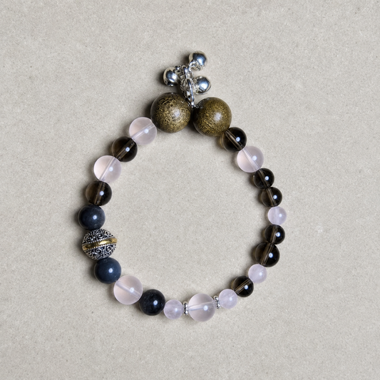 Love Frame Plan B bracelet with blush pink, smoky brown, blue-gray, warm brown, and silver-tone details on light stone