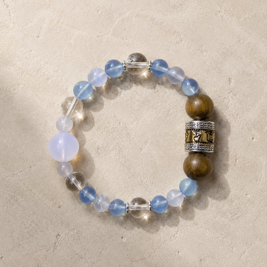 Maze Confidence Plan B bracelet with pale blue, clear, lavender, warm brown, and silver-tone details on light stone