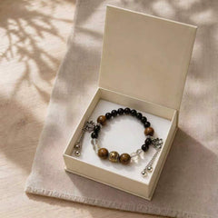 Still Ground Calm DIY crystal bracelet kit in a gift box with black, wood, clear, and silver beads thumbnail